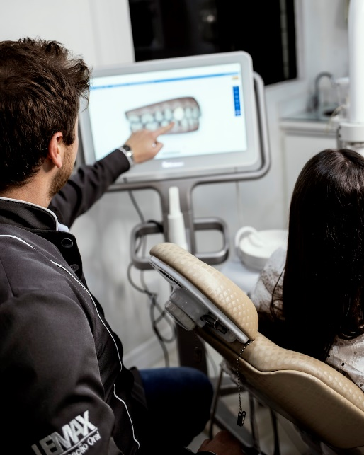 patient and doctor examining dental scan