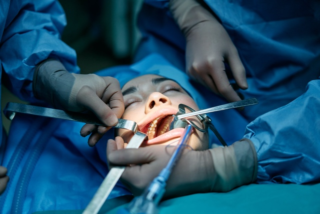 A woman patient getting an oral surgery